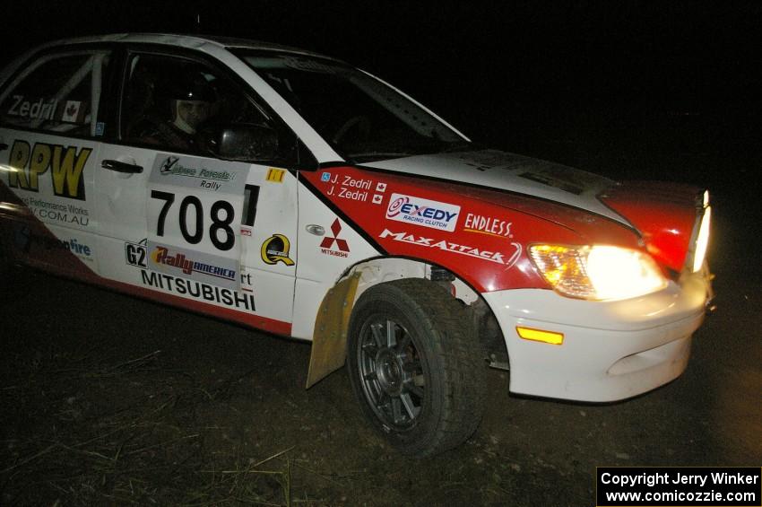 Jan Zedril / Jody Zedril take the downhill hairpin on SS7 in their Mitsubishi Lancer ES.