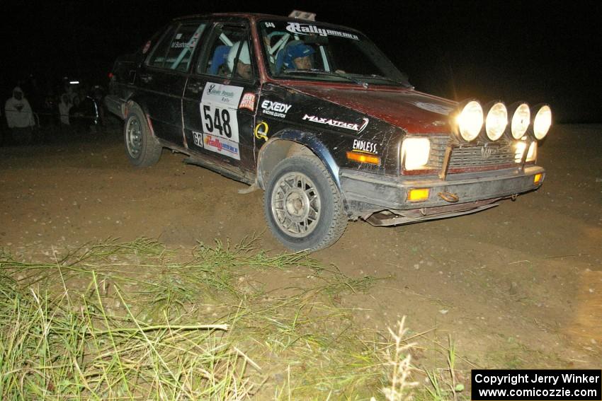 Matt Bushore / Kim DeMotte nail the apex of the downhill hairpin perfectly on SS7 in their VW Jetta.