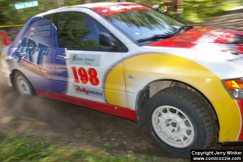 Arkadiusz Gruszka / Lukasz Wronski drift their Mitsubishi Lancer Evo 9 through a 90-right on SS8.