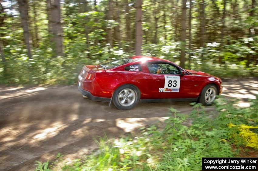 Mark Utecht / Rob Bohn rocket out of a 90-right on SS8 in their Ford Mustang.