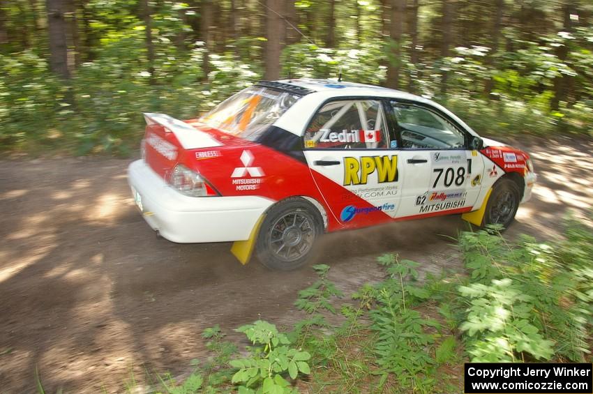 Jan Zedril / Jody Zedril come out of a 90-right on SS8 in their Mitsubishi Lancer ES.