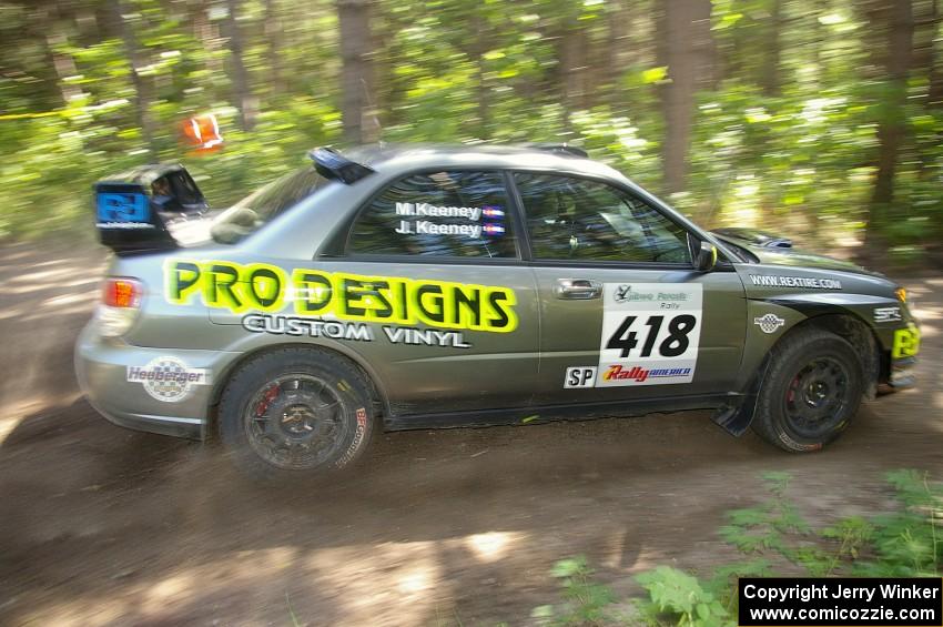 Jimmy Keeney / Missy Keeney power through a 90-right on SS8 in their Subaru WRX STi.