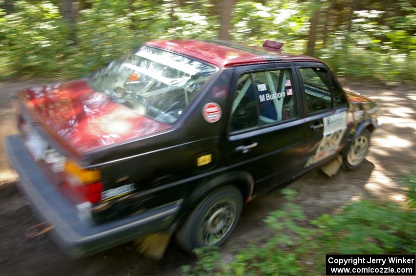 Matt Bushore / Kim DeMotte blast out of a 90-right on SS8 in their VW Jetta.