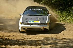 Adam Markut / Chris Gordon drift their Eagle Talon through an uphill 90-right on SS11.