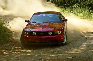 Mark Utecht / Rob Bohn drift the car through a right-hander on SS11, Indian Creek, in their Ford Mustang.