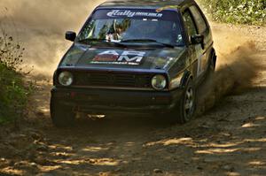 Chris Duplessis / Catherine Woods blast their VW GTI through a 90-right on SS11.