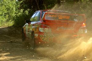 Nate Conley / Adam Kneipp set up nicely for the uphill 90-right on SS11 in their Subaru WRX STi.