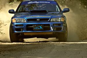 Piotr Fetela / Mariusz Malik scream out of a corner on SS11 in their Subaru Impreza.