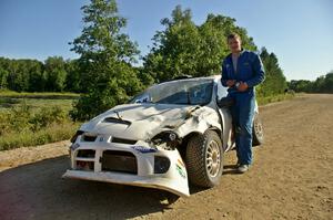 Zach Babcock stands in front of the Dodge SRT-4 he and Jack Penley rolled hard on SS11.(1)