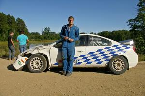 Zach Babcock stands in front of the Dodge SRT-4 he and Jack Penley rolled hard on SS11.(2)