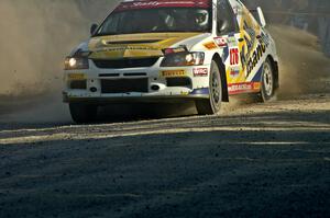 Andi Mancin / Maciej Wislawski in their Mitsubishi Lancer Evo 9 drive through the spectator location on SS12.