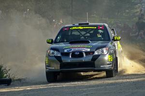 Jimmy Keeney / Missy Keeney throw gravel at the spectator point on SS12 in their Subaru WRX STi.