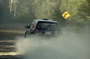 Paul Koll / Heath Nunnemacher fly down the couty road on SS12 in their VW Golf.