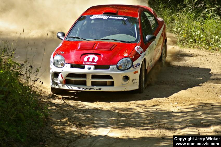 Lauchlin O'Sullivan / Karen Wagner drift their Dodge SRT-4 through a 90-right on SS11.