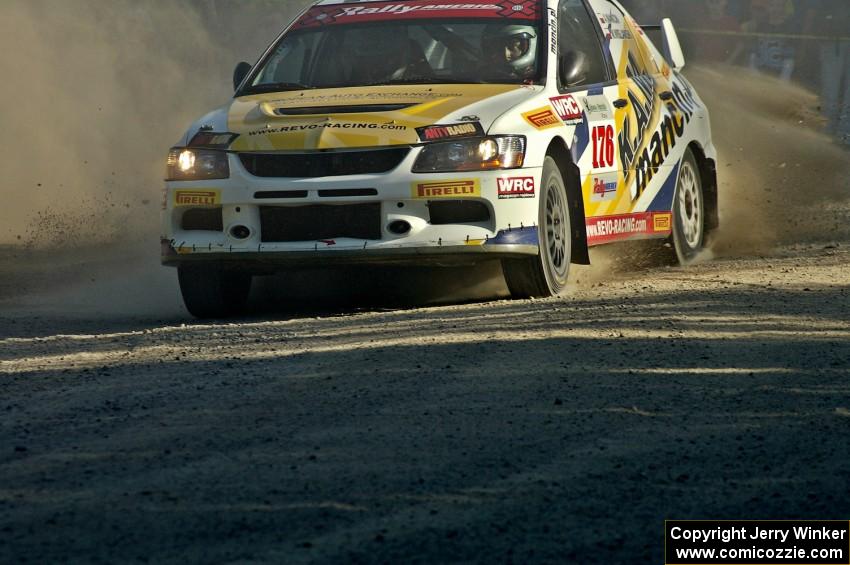 Andi Mancin / Maciej Wislawski in their Mitsubishi Lancer Evo 9 drive through the spectator location on SS12.