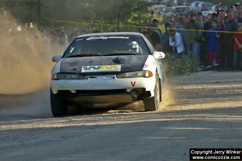 Adam Markut / Chris Gordon drift their Eagle Talon through the spectator-filled corner on SS12.