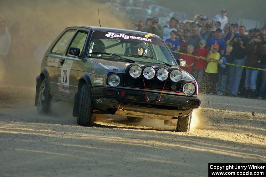 The Chris Duplessis / Catherine Woods VW GTI screams onto the county road at the spectator point on SS12.