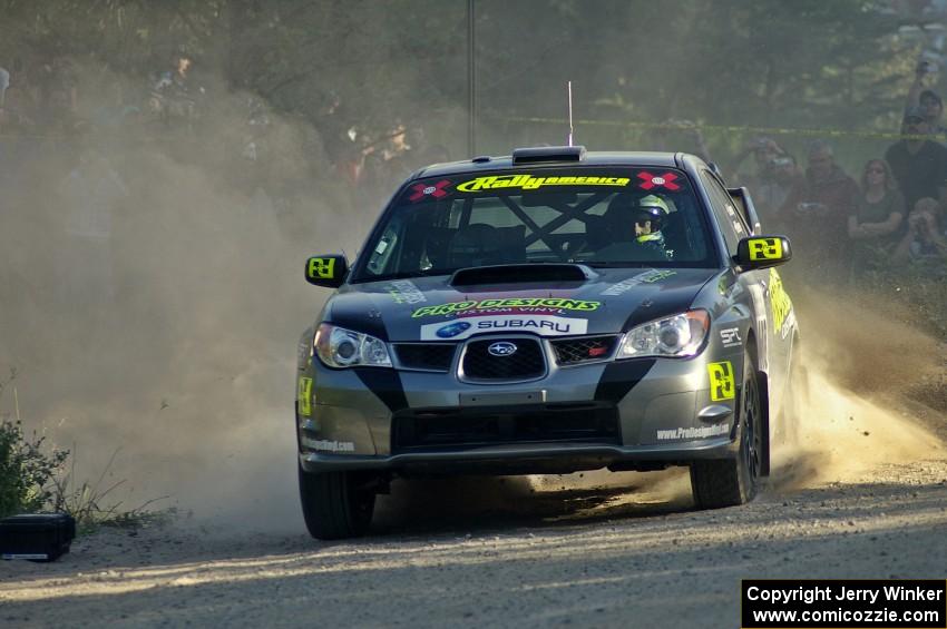 Jimmy Keeney / Missy Keeney throw gravel at the spectator point on SS12 in their Subaru WRX STi.