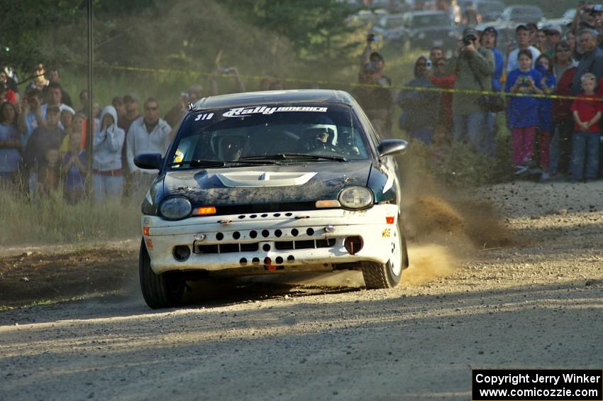 Chris Greenhouse / Don DeRose drift onto the county road at the spectator point on SS12 in their Plymouth Neon.