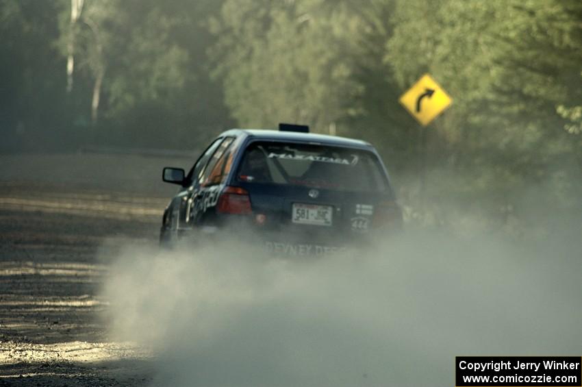 Paul Koll / Heath Nunnemacher fly down the couty road on SS12 in their VW Golf.