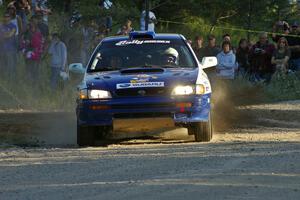 Mason Moyle / Scott Putnam Subaru Impreza drive onto the county road on SS12 as spectators watch.