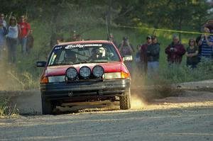 Paul Donlin / Elliot Sherwood in their Ford Escort fly past spectators on SS12.