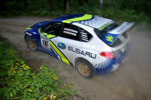 Travis Pastrana / Christian Edstrom at speed in their Subaru WRX STi at sundown on SS15.