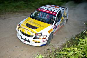 Andi Mancin / Maciej Wislawski flog their Mitsubishi Lancer Evo 9 through left sweeper on SS15.