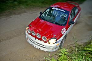 Lauchlin O'Sullivan / Karen Wagner beautifully drift their Dodge SRT-4 through a sweeper on SS15.