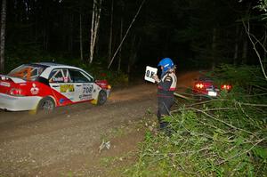 Jan Zedril / Jody Zedril in their Mitsubishi Lancer ES pass the stranded Mark Utecht / Rob Bohn Ford Mustang on SS15.