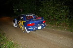 Piotr Fetela / Mariusz Malik fly down a straight on SS15 in their Subaru Impreza.