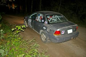 Dan Adamson / Matt Nichols in their Saturn SL2 on SS15 just after sundown.