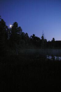 Moonrise over a lake on SS15 after the stage is run.
