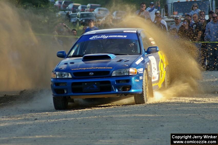 Piotr Fetela / Mariusz Malik slide their Subaru Impreza through the gravel for fans at the SS12 spectator point.