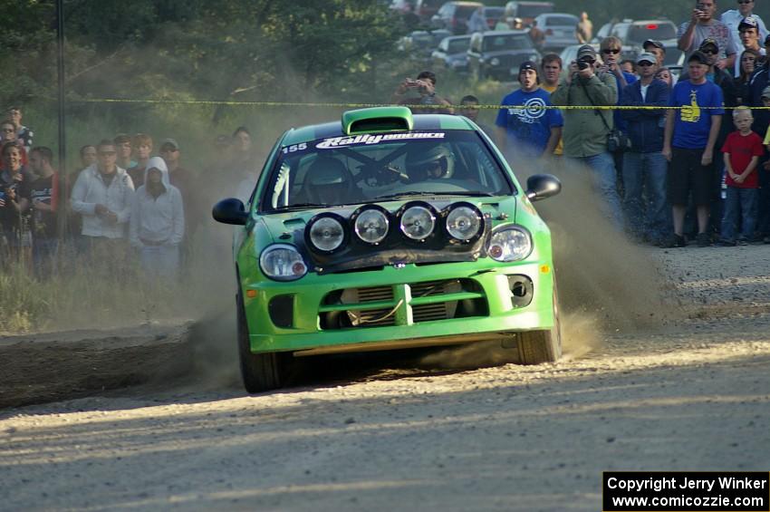 John Conley / Keith Rudolph drive their Dodge SRT-4 past the horde of spectators on SS12.
