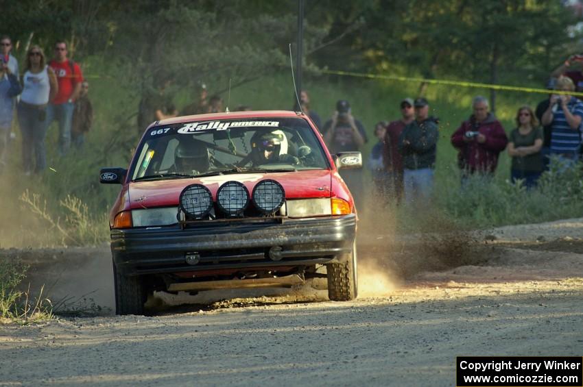 Paul Donlin / Elliot Sherwood in their Ford Escort fly past spectators on SS12.