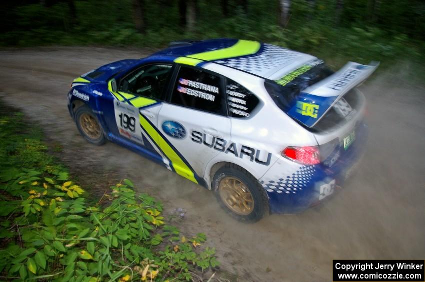 Travis Pastrana / Christian Edstrom at speed in their Subaru WRX STi at sundown on SS15.