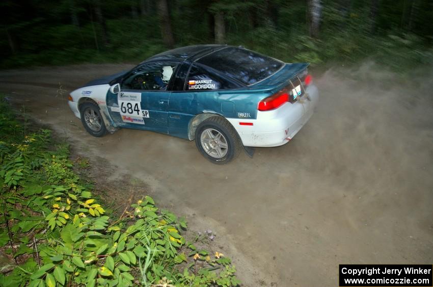 Adam Markut / Chris Gordon beautifully drift their Eagle Talon through a sweeper on SS15.