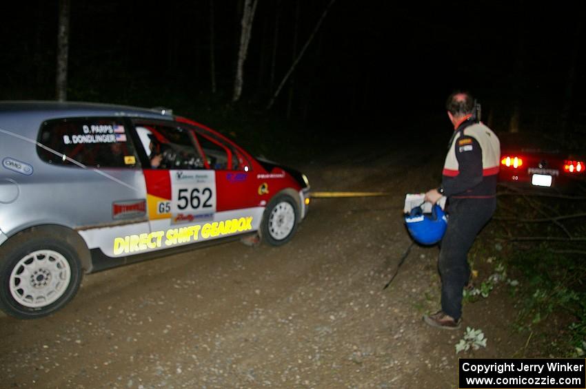 The Mark Utecht / Rob Bohn Ford Mustang is pulled out after being high-centered by the Brian Dondlinger/ Dave Parps VW GTI-