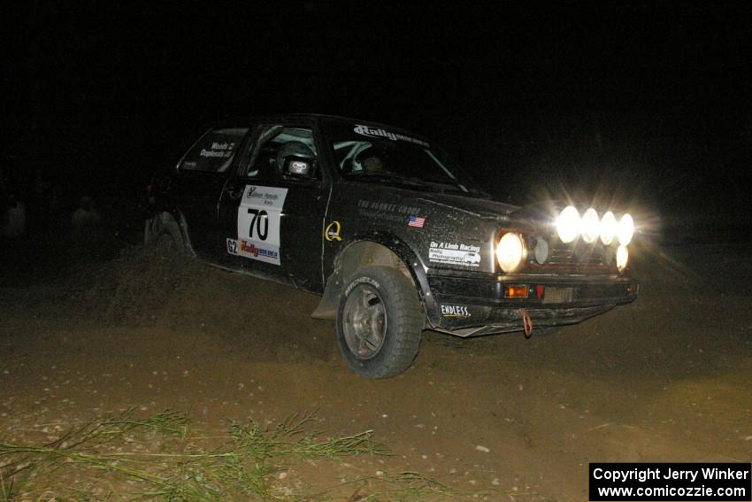 Chris Duplessis / Catherine Woods kick their VW GTI sideways on the downhill hairpin on SS7.