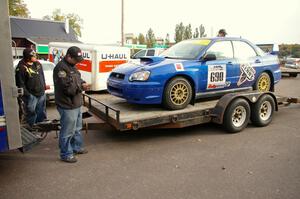 Micah Wiitala unloads the Kenny Bartram / Dennis Hotson Subaru WRX STi as Russ Johnson looks on.