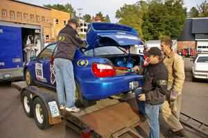 The Sisu Racing crew unloads the Kenny Bartram / Dennis Hotson Subaru WRX STi before it gets teched.