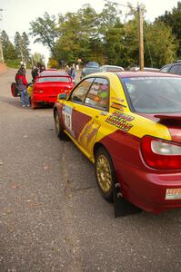 The Bryan Pepp / Jerry Stang Subaru WRX and Dustin Kasten / Corina Soto Subaru Impreza in the tech line.