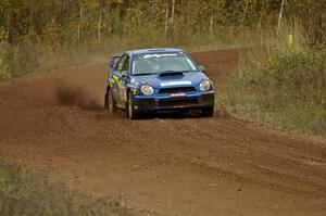 Janusz Topor / Michal Kaminski through a fast sweeper on the practice stage in their Subaru WRX STi.