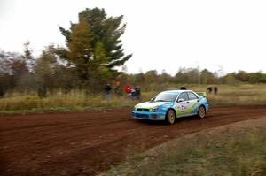 Pete Hascher / Scott Rhoades come into a tight corner on the practice stage in their Subaru WRX.