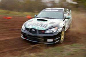 Mark Fox / Jake Blattner drift through a tight corner on the practice stage in their Subaru WRX STi.