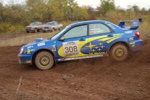 Janusz Topor / Michal Kaminski drift their Subaru WRX STi through a hairpin on the practice stage.