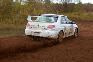 Heath Nunnemacher / Mike Rossey drift through a tight corner on the practice stage in their Subaru WRX STi.