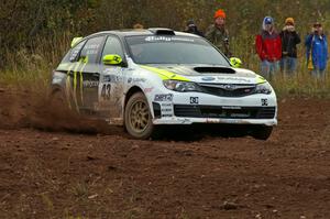 The Ken Block / Alex Gelsomino Subaru WRX STi takes a sharp corner on the practice stage.