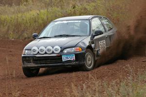 Silas Himes / Matt Himes power through a sweeper on the practice stage in their Honda Civic.
